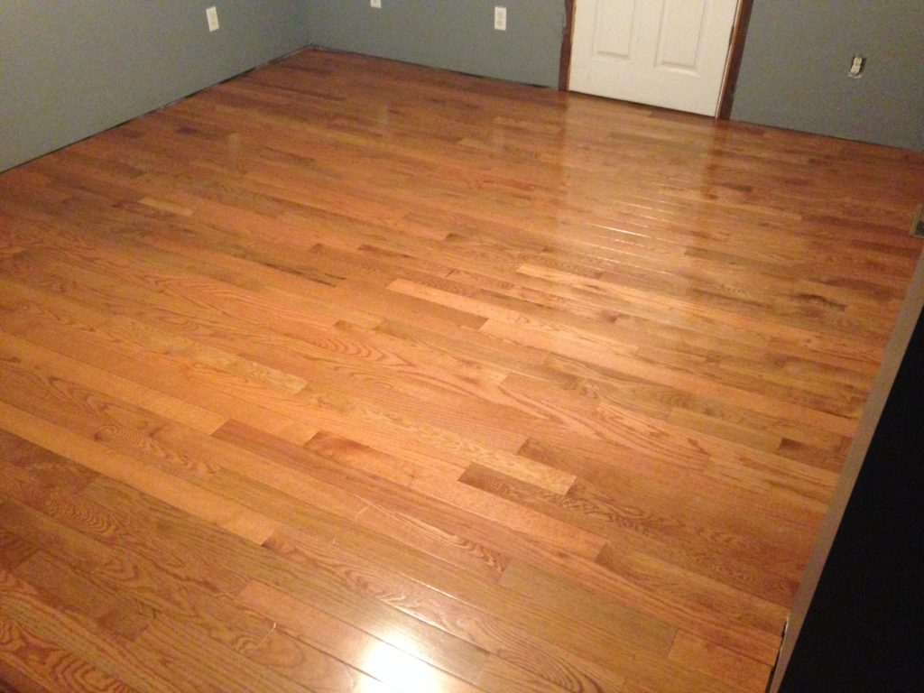 Wood floor refinishing job with a light color stain. Professional hardwood floor refinishing options now available to the public.