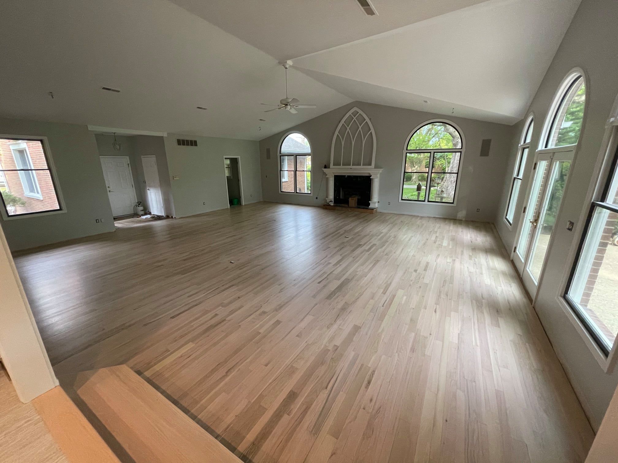 Large room in home with white oak floors.