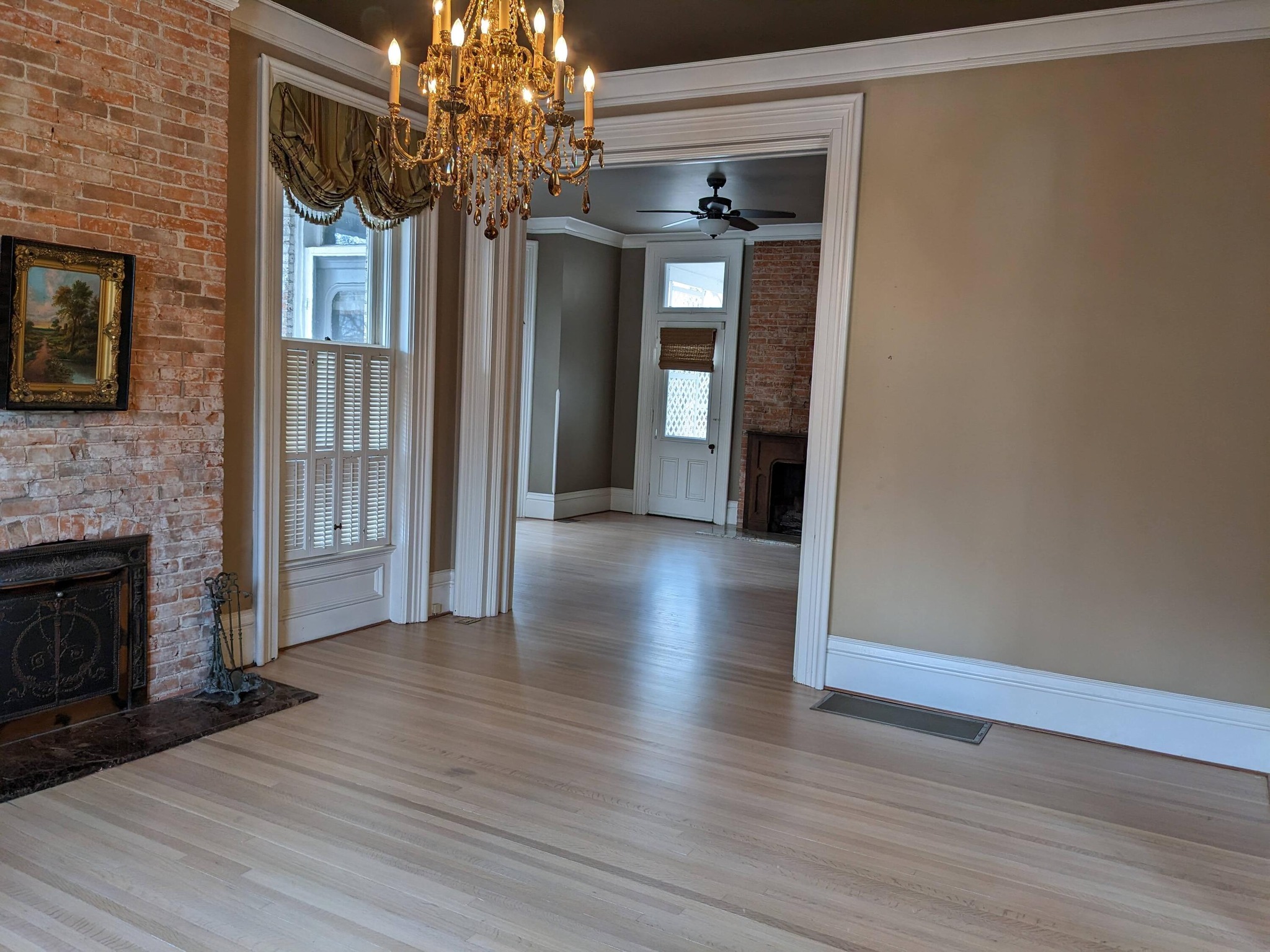 Historic home with newly refinished floors showing the entryway.