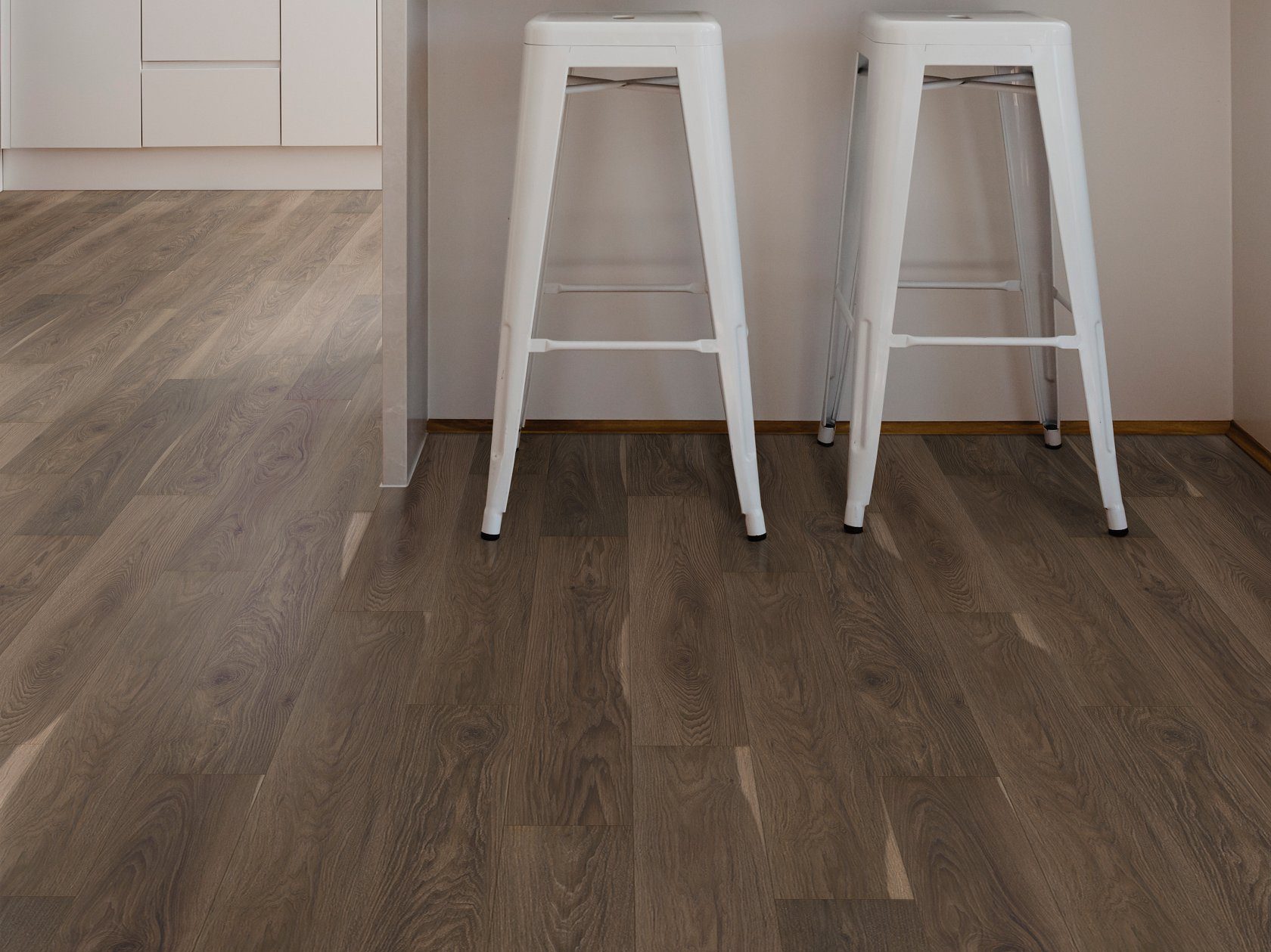 Bar stools in a room with Charred Earth flooring from Shaw in their Pantheon collection.