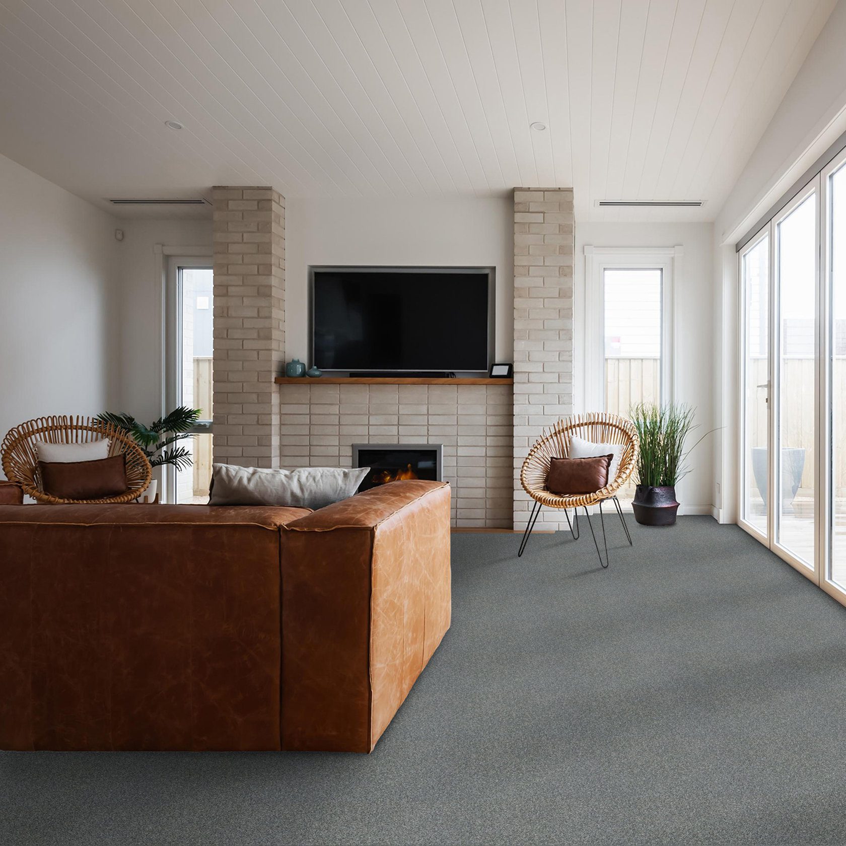 Room scene of a living room with a lot of natural light on Mountain Path carpet from Shaw installed throughout.