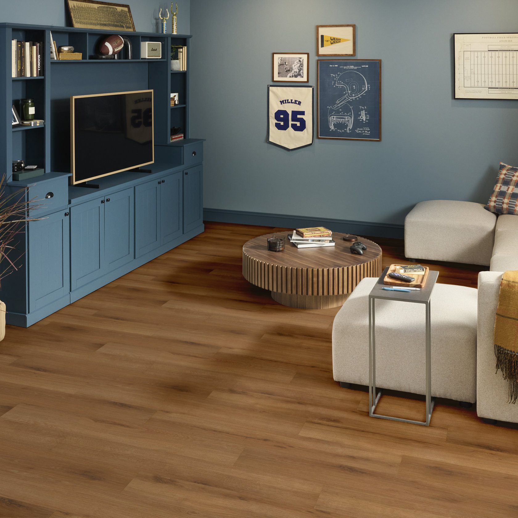 Shaw Fleetwood glue down plank in Harvest Oak color installed in a small living room.