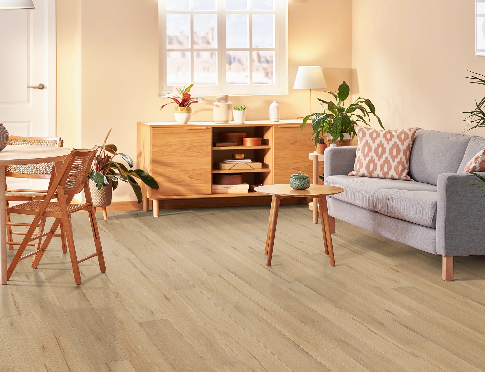 Shaw fleetwood sunbaked oak vinyl flooring installed in a nice living room space.